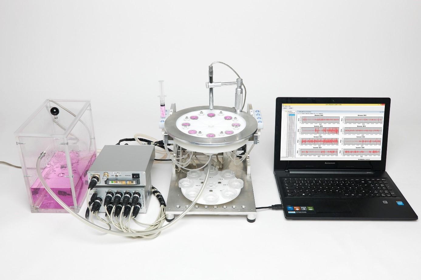 The Microimpedance Sensor System consisting of storage tank, flow-through pump, instrument, chamber block and laptop with software (from left to right) 